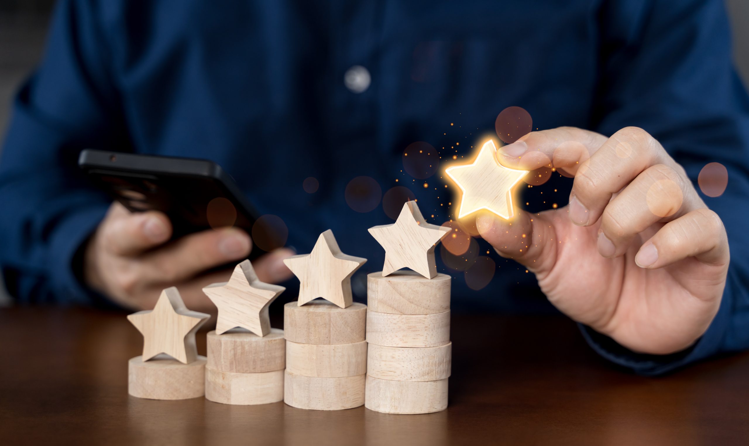 Close up of businessman customer giving a five star rating on sm
